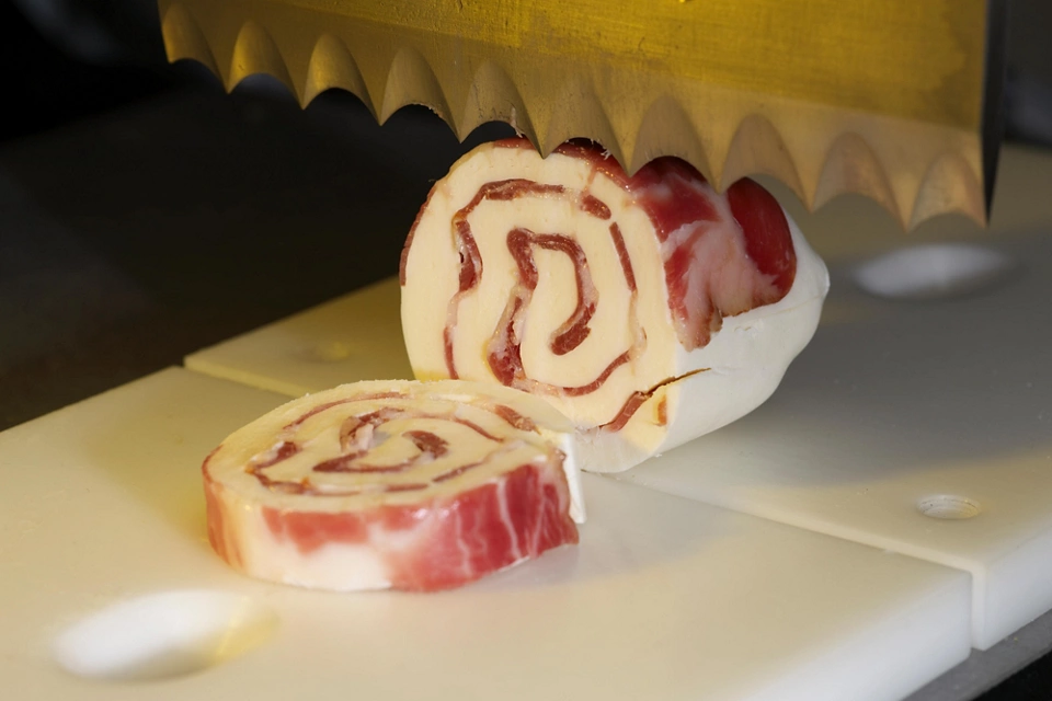 ultrasonic cutting of meat rolled cheese
